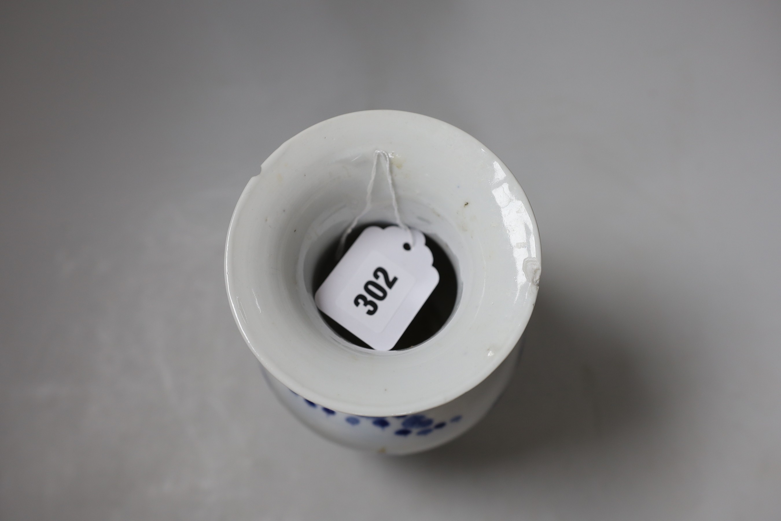 A small Chinese twin handled blue and white porcelain vase, Kangxi marks to underside, 19th century, 20cms high